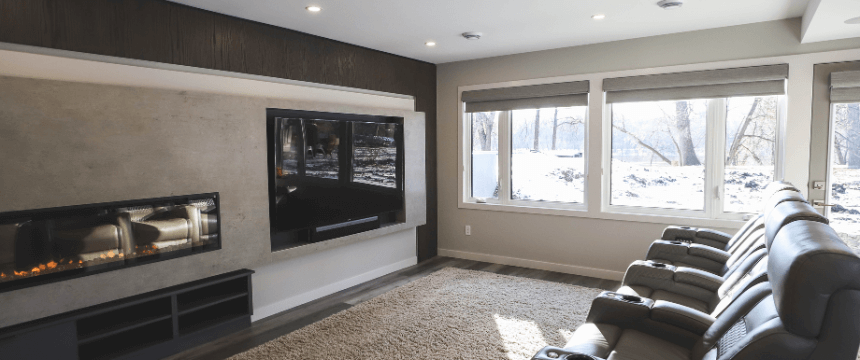 Winnipeg basement renovation with home theatre and fireplace